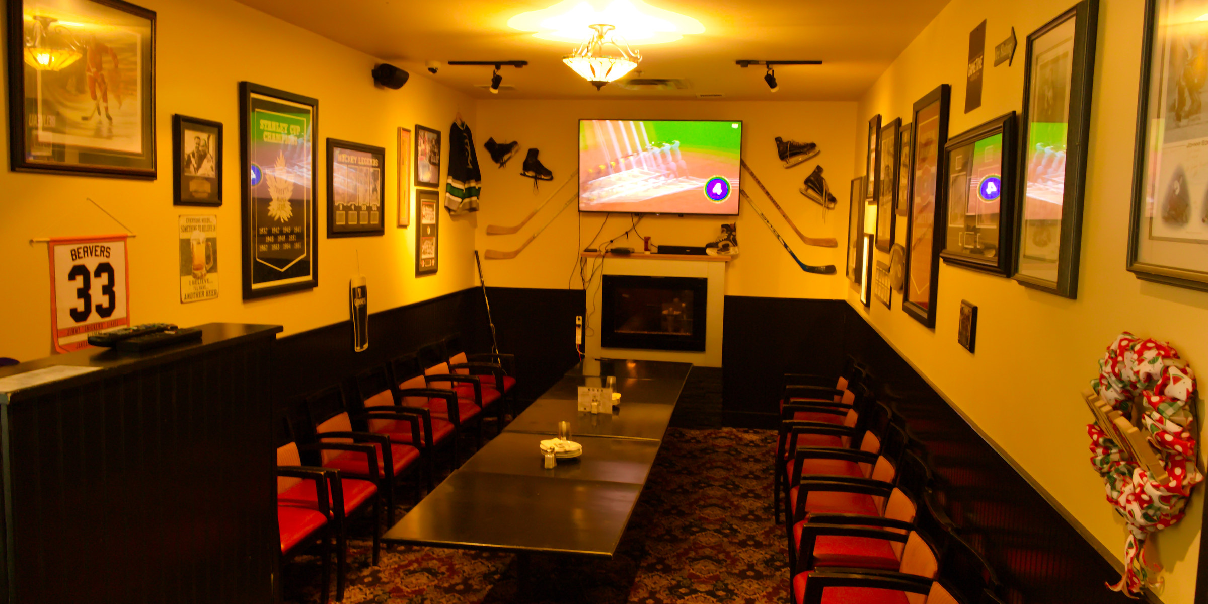 The private party room at Puckz Pub, jerseys on the walls and a long table set